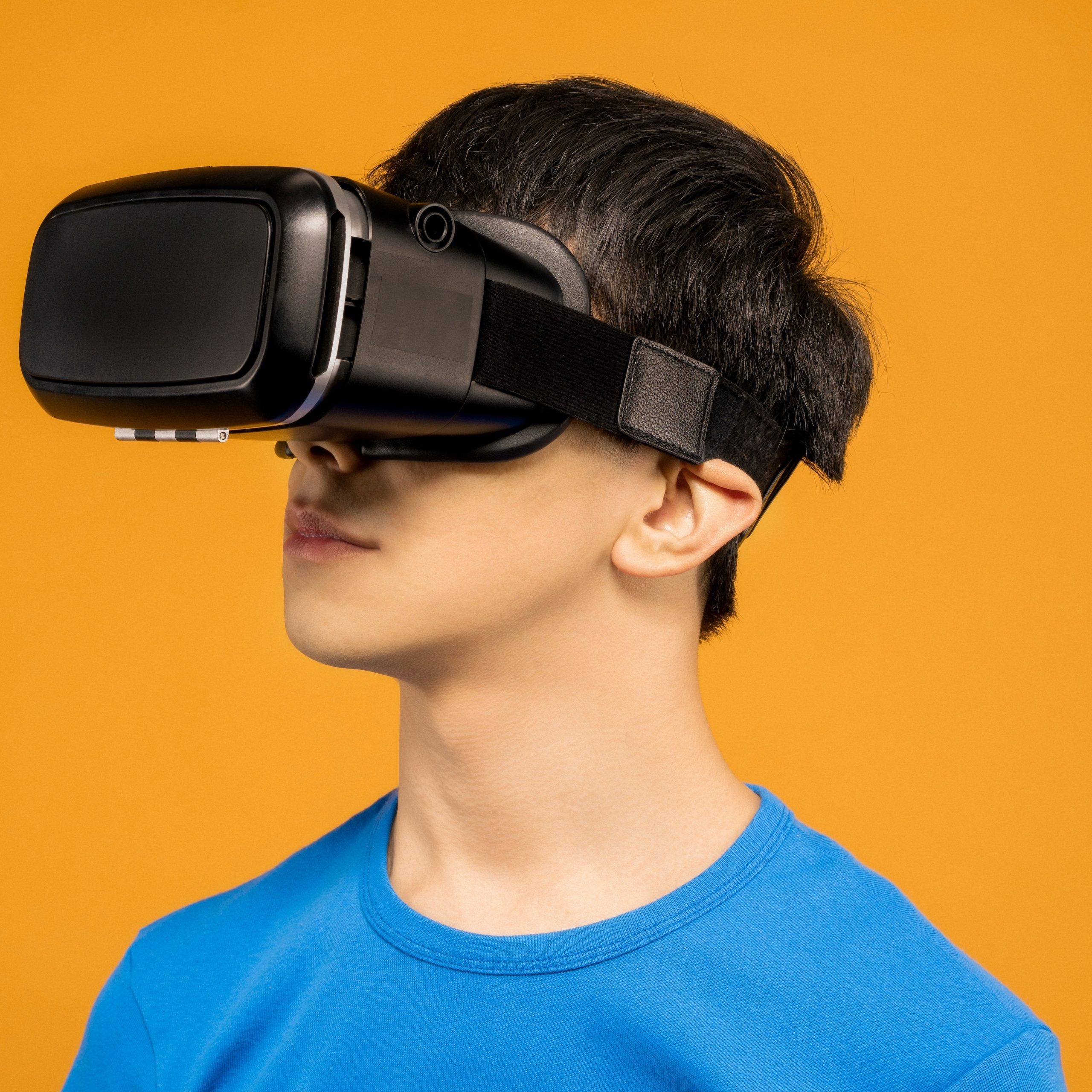 man-in-blue-crew-neck-shirt-wearing-black-vr-headset-3761105-scaled